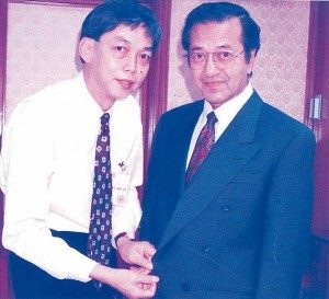 Robert Loh fitting Tun Dr Mahathir